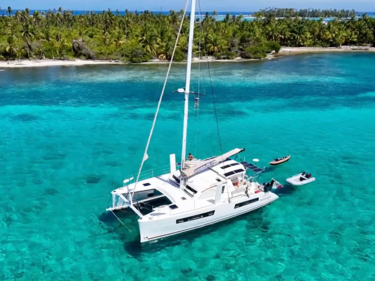 The Ikigai catamaran at anchor over the shallows of San Blas, seen from above.